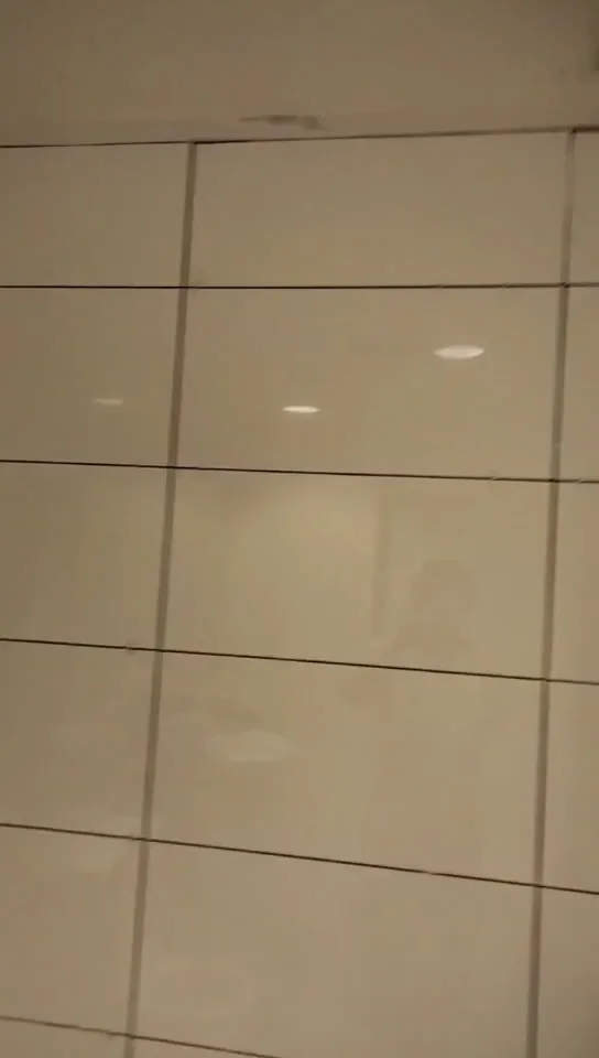 White wall tiles and open joints during the North Terrace wall-tiling stage